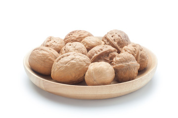 Walnuts in a wooden plate