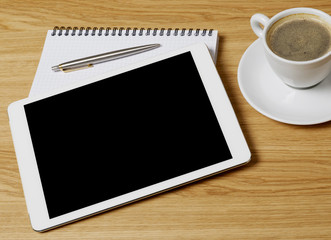 Tablet, notebook and coffee