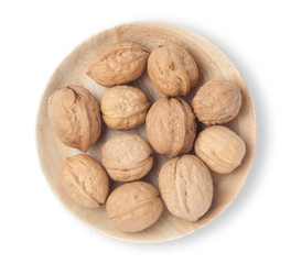 Walnuts in a wooden plate