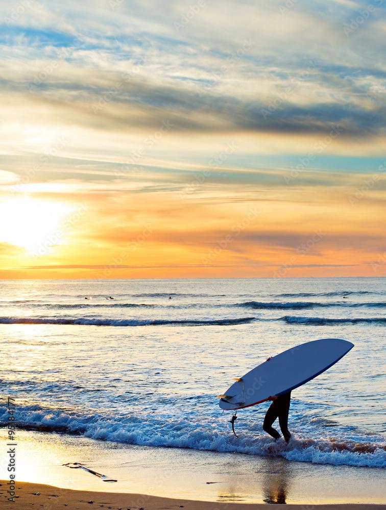 Wall mural paddle surfing at sunset, portugal