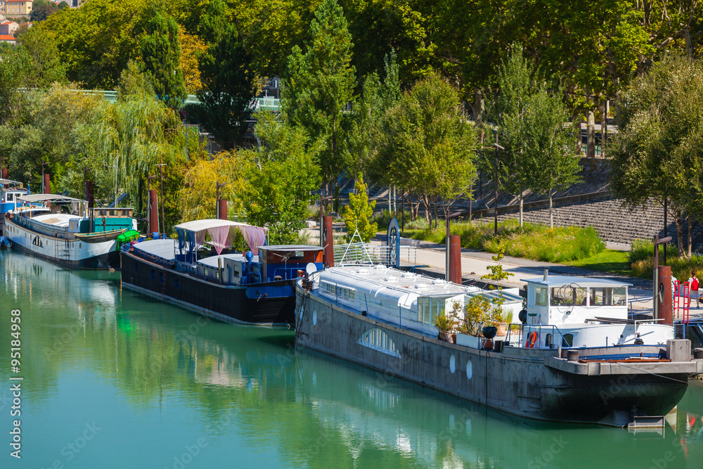 Poster View of houseboats on the river in Lyon, France