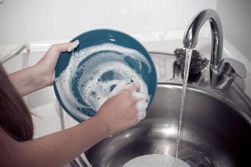 House chores - Washing the dishes on the kitchen sink