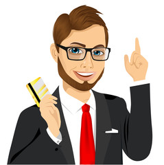 businessman with glasses holding golden credit card