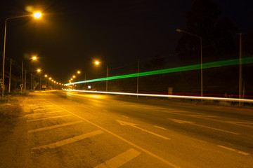 Night Road at suburban with the light trails car
