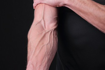 Bodybuilders hand with veins. Power, strong muscular athletic man, perfect body, hard work, male fitness motivation - obrazy, fototapety, plakaty