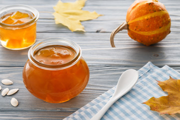 Fresh pumpkin jam on a blue background