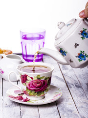 Pouring tea into cup