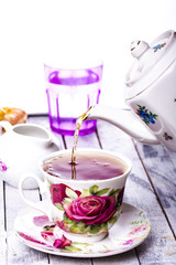 Pouring tea into cup