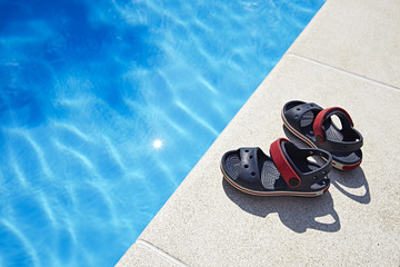 Baby sandals at the swimming pool