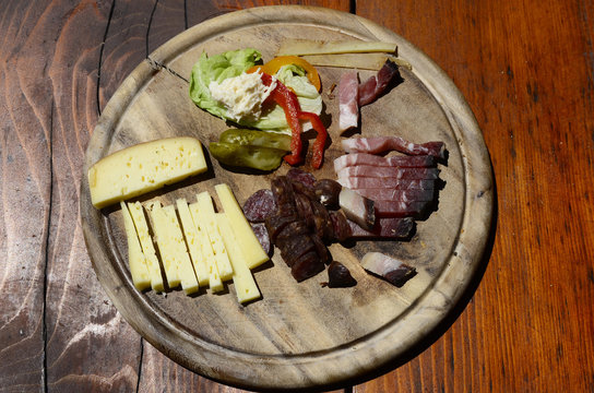 snack named Marend in South Tyrol, Brettljause in Austria, Brotzeit in Germany