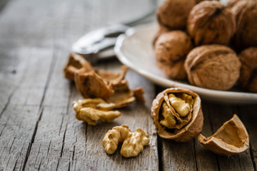 Whole walnuts on rustic background
