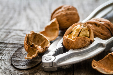 Whole walnuts on rustic background
