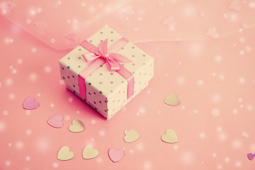 Beautiful gift box on pink background