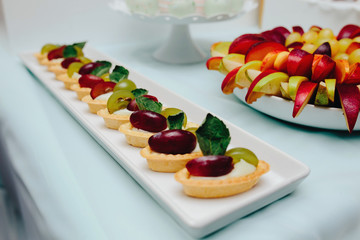 Delicious fancy wedding cake and fruit