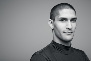 Obraz premium Young handsome sexy athlete in a black shirt