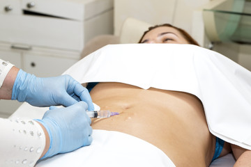 Fototapeta premium woman is in the process cellulite mesotherapy clinic