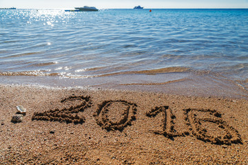 New Year 2016  concept on the sea beach.