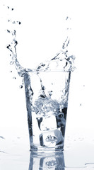 Glass of water with ice and splash