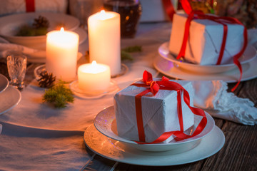 Christmas table setting with present and tree