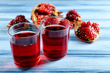 Fresh garnet juice with fruit on table close up
