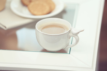 Cup of coffee on table close up