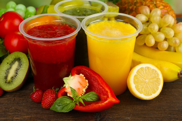 Fototapeta na wymiar Fresh juice mix fruit, healthy drinks on wooden table background