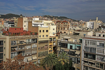 Fototapeta na wymiar BARCELONA, CATALONIA, SPAIN - DECEMBER 13, 2011: Multi-storey buildings and roofs in Barcelona