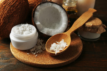 Spa coconut products on dark wooden background