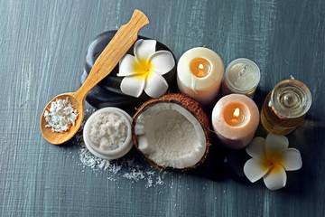 Spa coconut products on dark wooden background