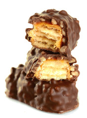 Tasty broken chocolate bars isolated on white background