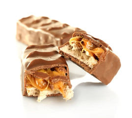 Tasty broken chocolate bars isolated on white background