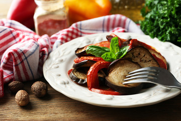 Ratatouille on plate, on table background