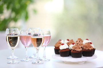 Tasting of wine and chocolate cupcakes, close up