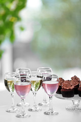Tasting of wine and chocolate cupcakes, close up