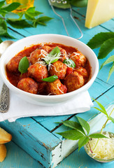 meatballs in tomato sauce with basil.
