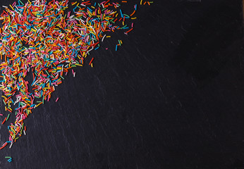 Fototapeta premium Fun sweet frame on slate black background