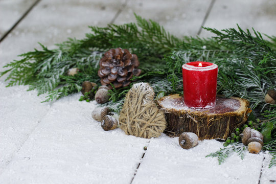Holiday Candle On Log With Winter Background