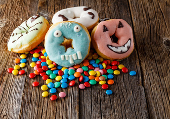 Halloween donuts on wooden table