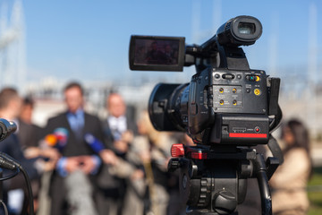 News conference. Filming an event with a video camera.