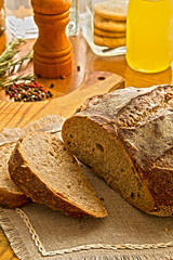 Fresh Tradition bread laying on the cutting board with kitchen utensils