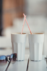 Morning coffee at a table in summer cafe