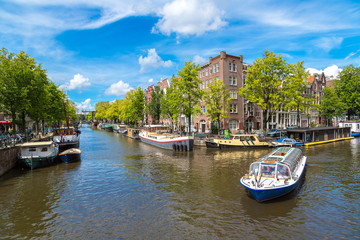 Fototapeta premium Amsterdam canals and boats, Holland, Netherlands.