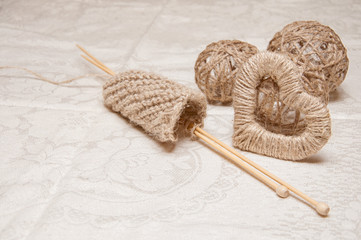 beige knitting and jewelry made of thread