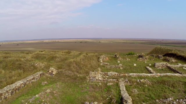 The ruins of the ancient Geto-Dacian settlement Dinogetia located on the right bank of the Danube (aerial view) in Dobrogea, Romania
