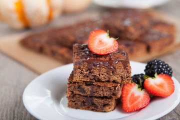 Flourless healthy pumpkin brownies with chocolate chips, selective focus