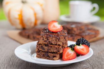 Flourless healthy pumpkin brownies with chocolate chips, selective focus