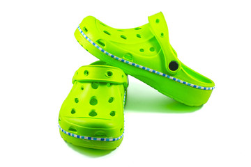 Green rubber sandals on a white background