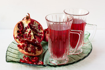 Pomegranatr drink and pomegranate pieces.