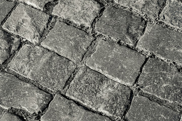 Obraz premium The road gently laid flat stones. Background.