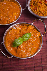 Chicken Tikka Masala Curry on Rattan Background
